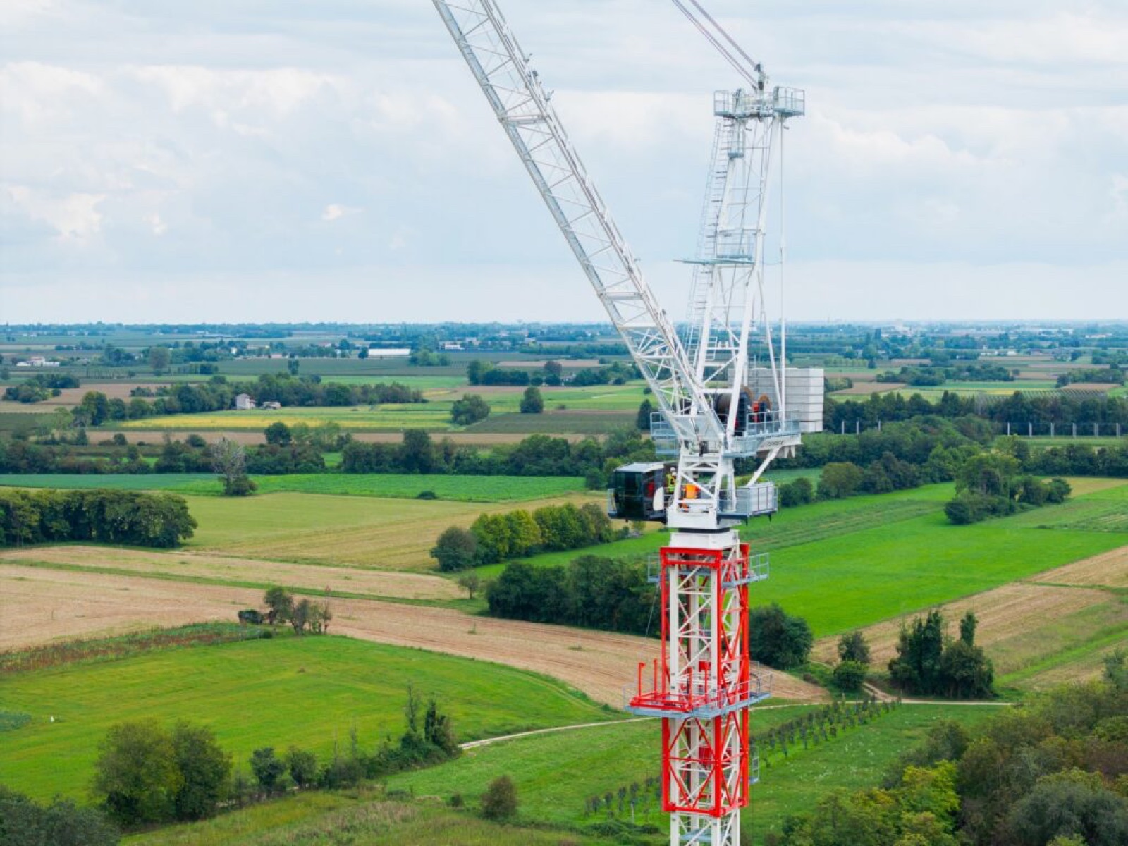 Terex CTL 712-45 luffing jib tower crane erected over farmland